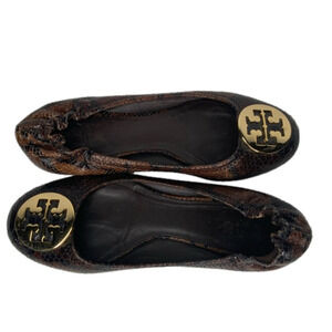 Tory Burch brown leather snakeskin flats.‎